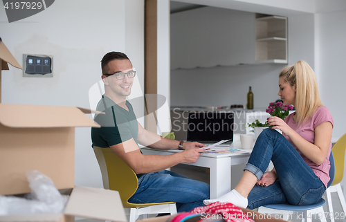 Image of Young couple moving in a new home