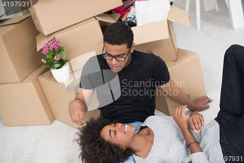 Image of African American couple relaxing in new house