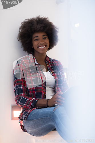 Image of black woman using her electronic tablet