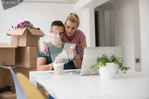 Image of Young couple moving in a new home