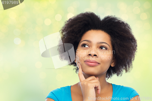 Image of happy african american young woman over white