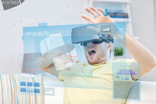 Image of young man in virtual reality headset or 3d glasses