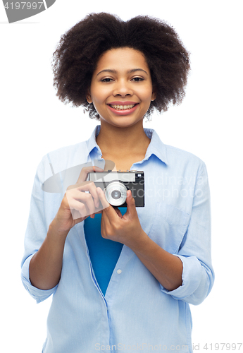 Image of happy african american woman with film camera