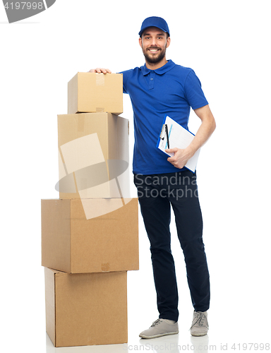 Image of happy delivery man with parcel boxes and clipboard