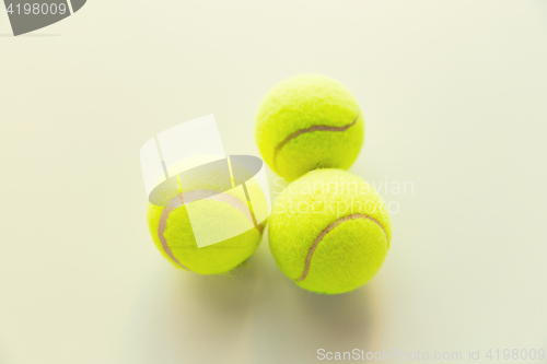 Image of close up of three yellow tennis balls