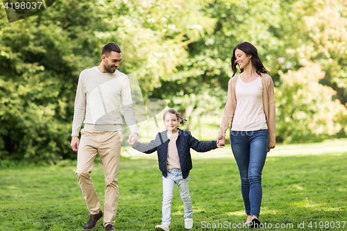 Image of happy family walking in summer park