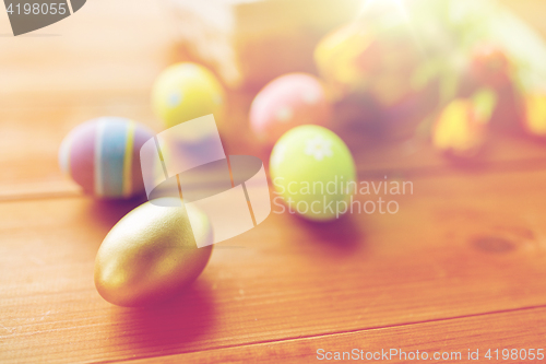 Image of close up of colored easter eggs and flowers