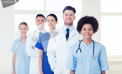 Image of group of happy doctors at hospital