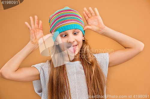 Image of The face of playful happy teen girl