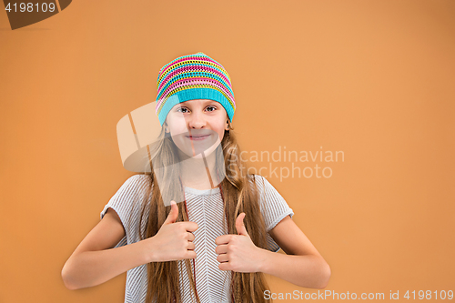 Image of The face of playful happy teen girl