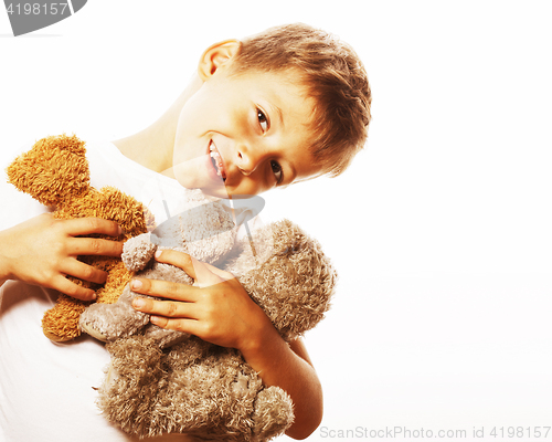 Image of little cute boy with many teddy bears hugging isolated close up