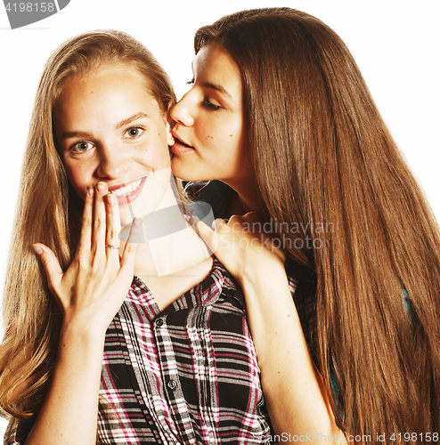 Image of two cute teenagers having fun together isolated on white