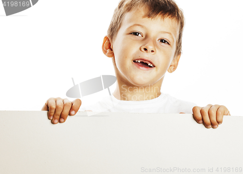 Image of little cute boy holding empty shit to copyspace isolated close u