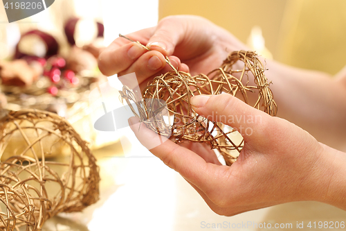 Image of Christmas decoration, golden bells Golden bells made of sticks