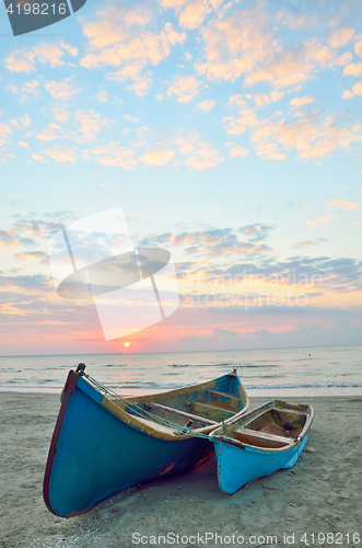 Image of Blue boats on beach 