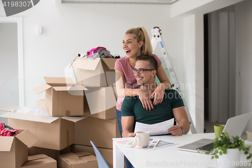 Image of Young couple moving in a new home