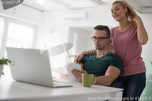 Image of Young couple moving in a new home