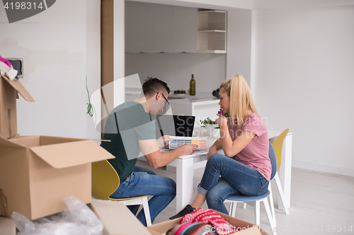 Image of Young couple moving in a new home