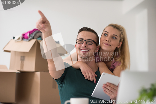 Image of Young couple moving in a new home