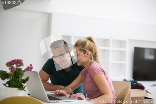 Image of Young couple moving in a new home