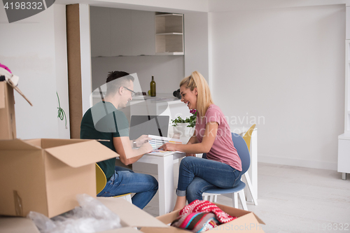 Image of Young couple moving in a new home