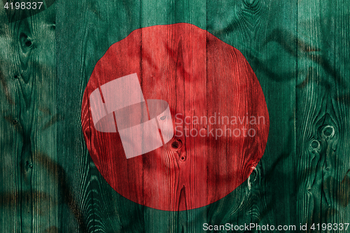 Image of National flag of Bangladesh, wooden background