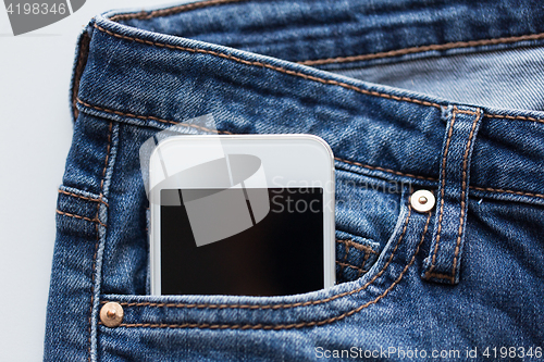 Image of smartphone in pocket of denim pants or jeans