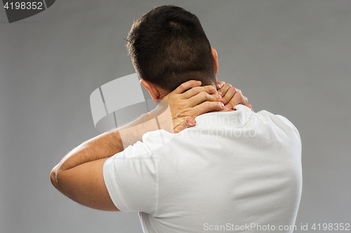 Image of close up of man suffering from neck pain