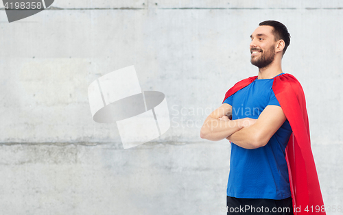 Image of happy man in red superhero cape