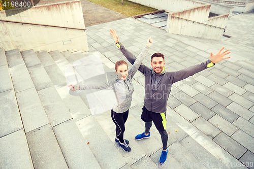 Image of happy smiling couple outdoors on city street