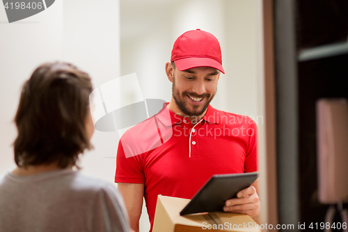 Image of deliveryman with tablet pc and box at customer