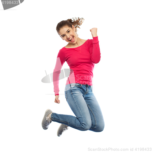 Image of smiling young woman jumping in air