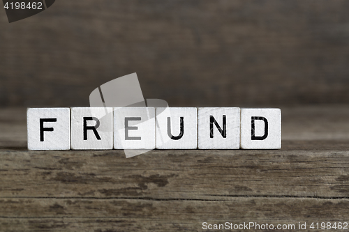 Image of German word friend, written in cubes