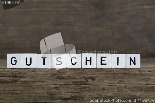 Image of German word voucher, written in cubes