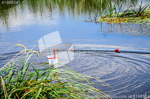 Image of Take samples of water for laboratory testing.