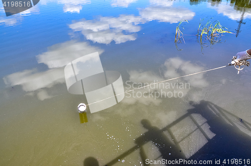 Image of Take samples of water for laboratory testing. The concept - analysis of water purity, environment, ecology.