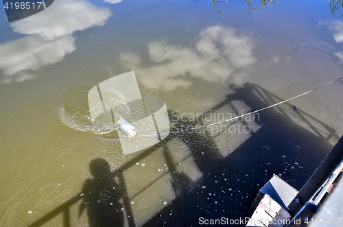 Image of Take samples of water for laboratory testing. The concept - analysis of water purity, environment, ecology.