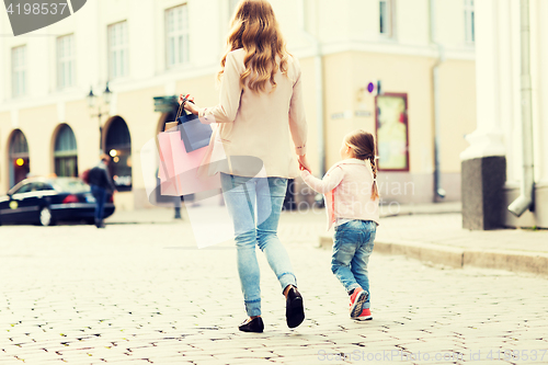 Image of close up of mother and child shopping in city