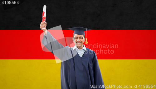 Image of happy male student with diploma  over german flag