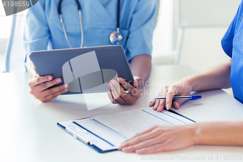 Image of close up of doctors with tablet pc at hospital