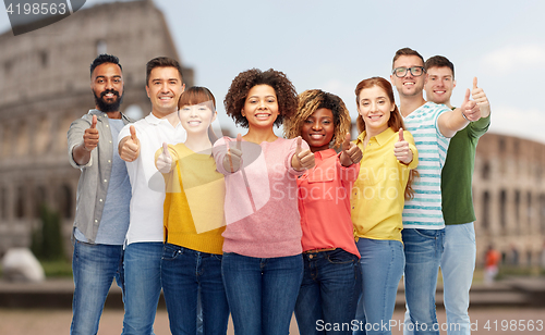 Image of happy people showing thumbs up over coliseum