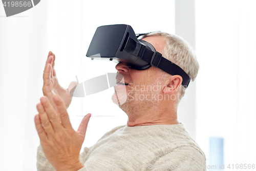 Image of old man in virtual reality headset or 3d glasses