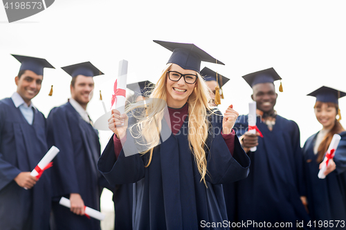 Image of happy student with diploma celebrating graduation