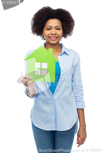 Image of happy african american woman with green house icon