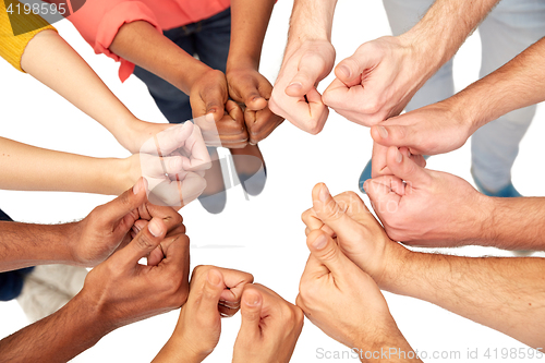 Image of hands of international people showing thumbs up