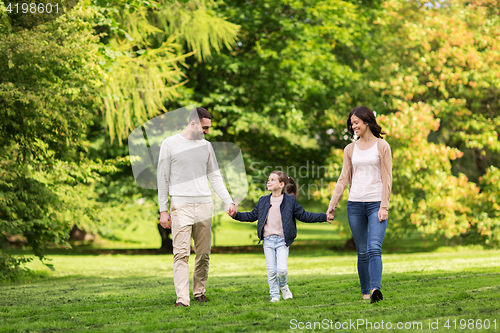 Image of happy family walking in summer park