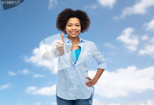 Image of happy african american woman showing thumbs up