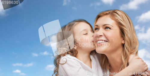 Image of happy little girl hugging and kissing her mother