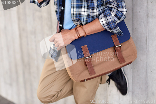 Image of close up of hipster man with stylish shoulder bag