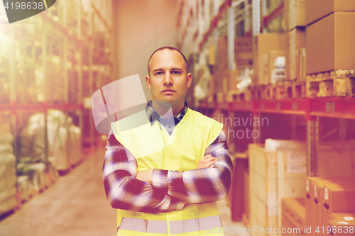 Image of man in reflective safety vest at warehouse